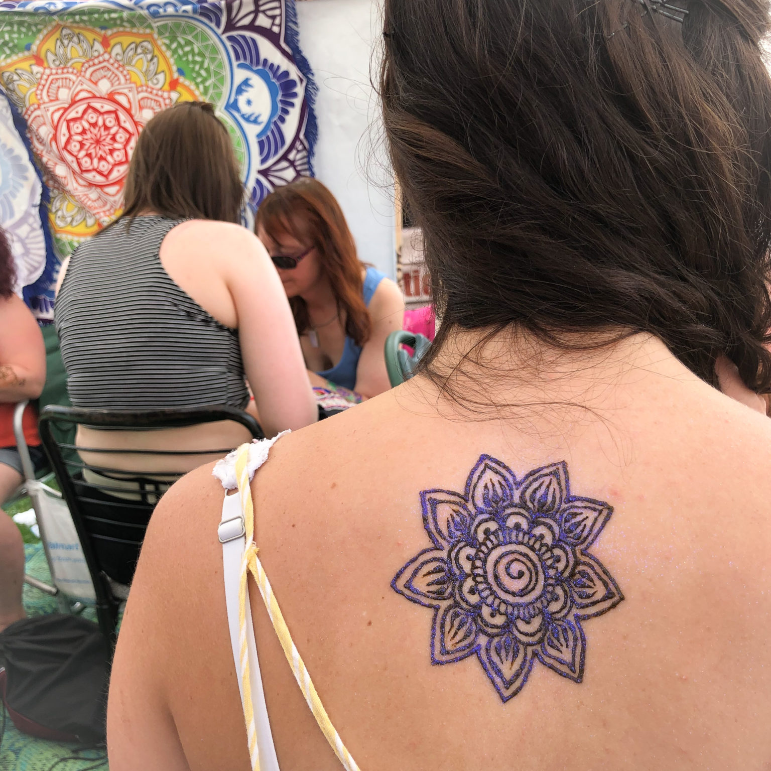 Mandala henna on a clients back