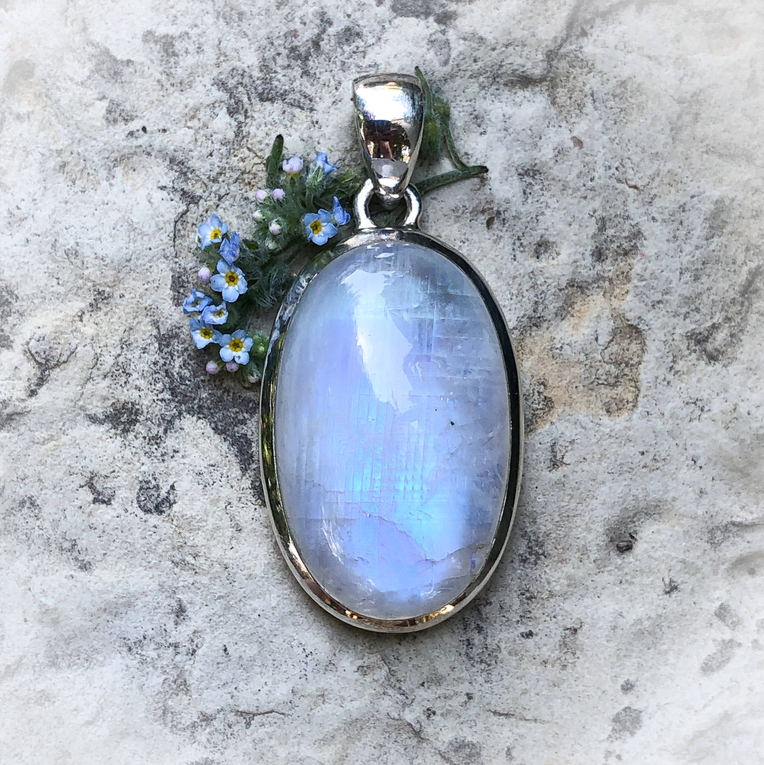 rainbow moonstone pendant with forget-me-nots